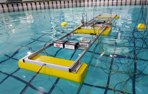 Scale model floating in FloWave test tank